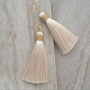 Tassel cream earrings with gold bead accents
